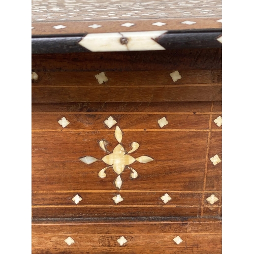 252 - HOSHIARPUR TABLE, 19th century North Indian octagonal hardwood and profusely bone inlaid with coform... 