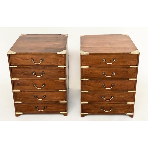 258 - CAMPAIGN CHESTS, a pair, antique Indian teak and brass bound bound each with five drawers, 45cm W x5... 