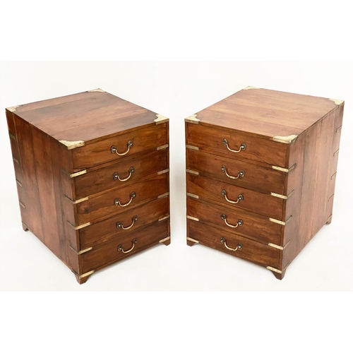 258 - CAMPAIGN CHESTS, a pair, antique Indian teak and brass bound bound each with five drawers, 45cm W x5... 