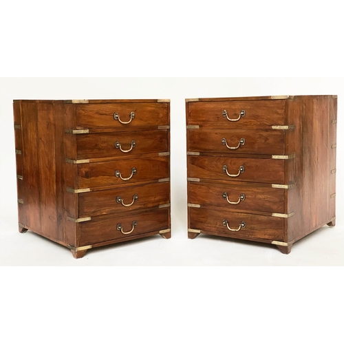 258 - CAMPAIGN CHESTS, a pair, antique Indian teak and brass bound bound each with five drawers, 45cm W x5... 