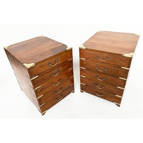 258 - CAMPAIGN CHESTS, a pair, antique Indian teak and brass bound bound each with five drawers, 45cm W x5... 