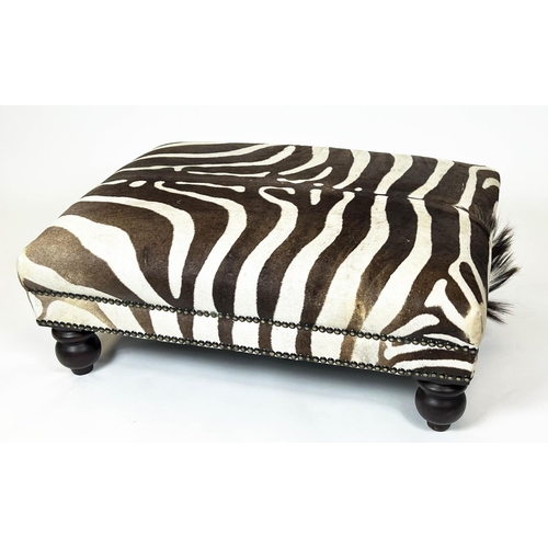 326 - ZEBRA SKIN FOOTSTOOL, rectangular studded zebra hide upholstered on turned wooden supports, 43cm H x... 