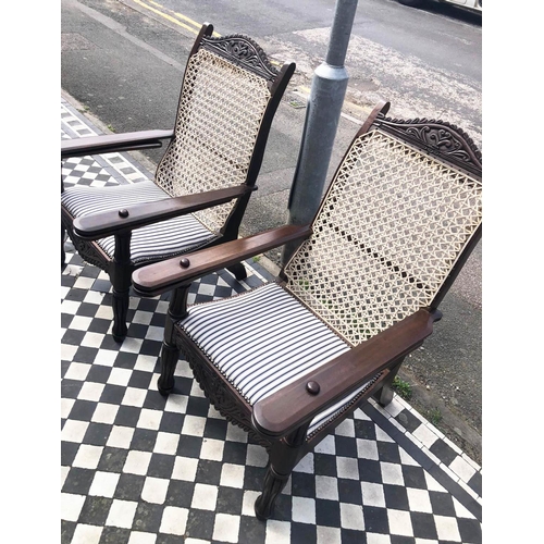 387 - PLANTERS CHAIRS, 100cm H , 65cm W, a pair, carved hardwood with string backs, padded ticking seats a... 