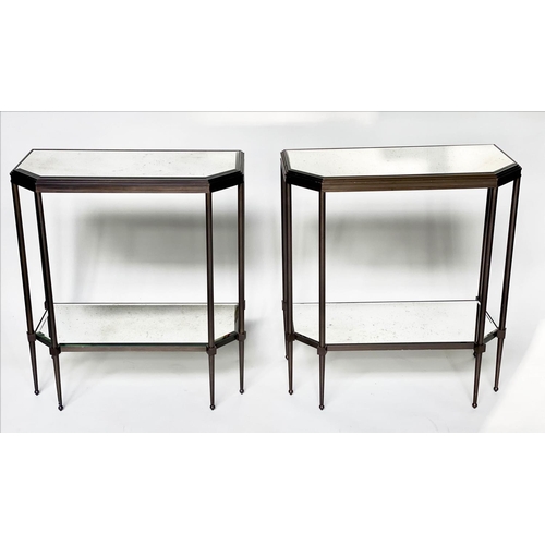 434 - CONSOLE TABLES, a pair, forged metal with two bevelled mirror shelves and canted front corners, 88cm... 