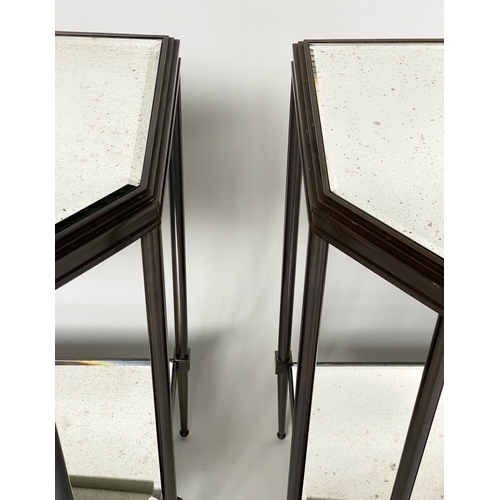 434 - CONSOLE TABLES, a pair, forged metal with two bevelled mirror shelves and canted front corners, 88cm... 