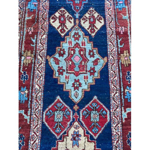 144A - ANTIQUE PERSIAN HERIZ RUNNER, 464cm x 82cm.