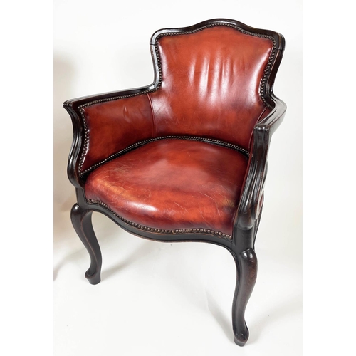 120 - BERGERE TUB ARMCHAIRS, a pair, in burgundy leather having shaped carved sinuous mahogany showframe w... 