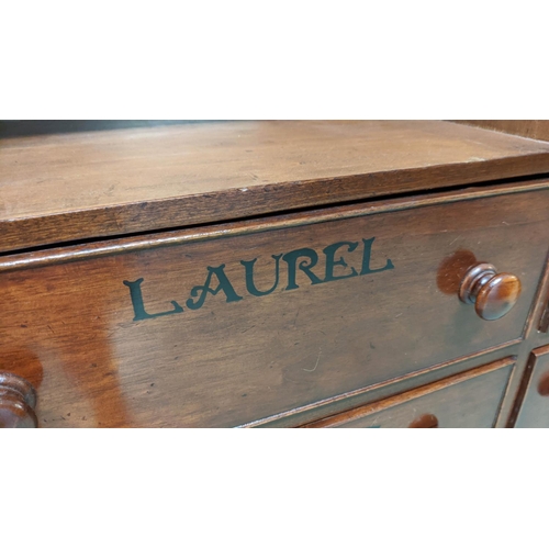 288 - APOTHECARY CABINET, 39cm  x 158cm W x 183cm H, Victoria mahogany with carved detail and named.