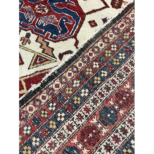 55 - ANTIQUE CAUCASIAN CARPET, 280cm x 163cm.