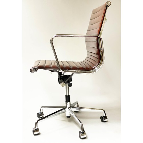 261 - REVOLVING DESK CHAIR, Charles and Ray Eames inspired with ribbed tan leather on an adjustable base w... 