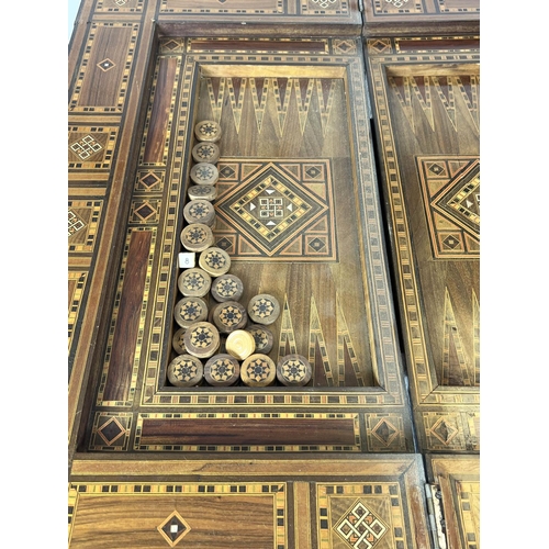 295 - GAMES TABLE, 84cm H x 83cm W x 81cm D, early 20th century Damascus parquetry with green fabric hinge... 