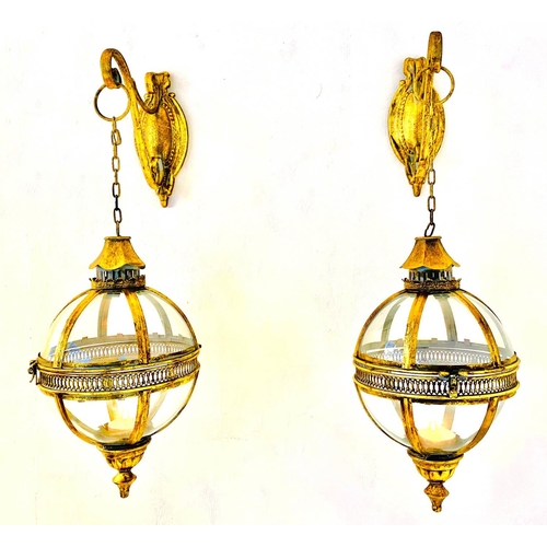 372 - WALL HANGING CANDLE LANTERNS, a pair, on brackets, gilt metal and glass, regency style design, 80cm ... 