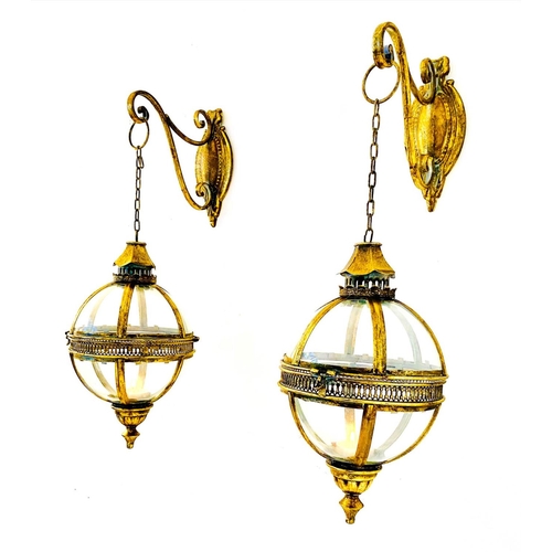 372 - WALL HANGING CANDLE LANTERNS, a pair, on brackets, gilt metal and glass, regency style design, 80cm ... 