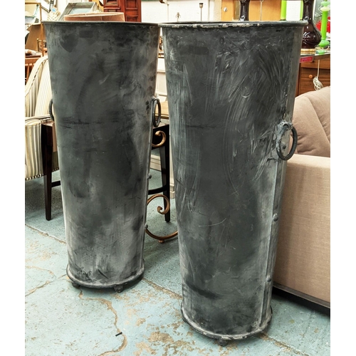 317 - TALL PLANTERS, a pair, 119cm x 53cm diam. each, aged metal, with ring handle detail and ball feet. (... 