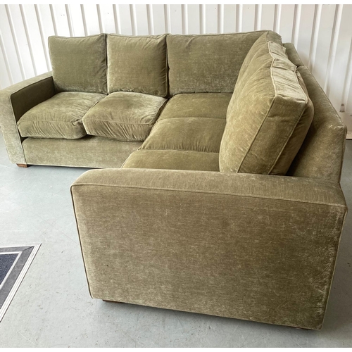 412 - CORNER SOFA, moss green velvet upholstered 254cm x 226cm.