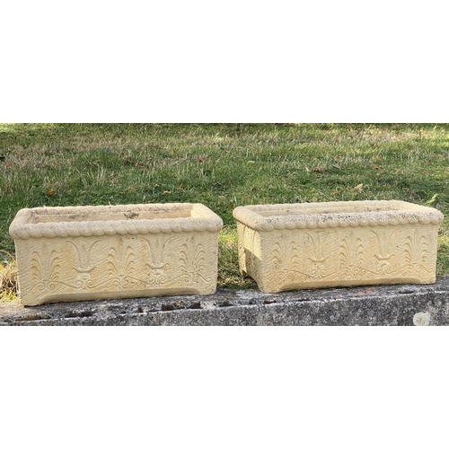 145 - WINDOW BOXES/PLANTERS, a pair, 54cm W x 20cm H x 30cm D, Cotswold stone style, with acanthus leaf de... 