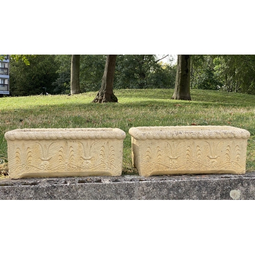 145 - WINDOW BOXES/PLANTERS, a pair, 54cm W x 20cm H x 30cm D, Cotswold stone style, with acanthus leaf de... 