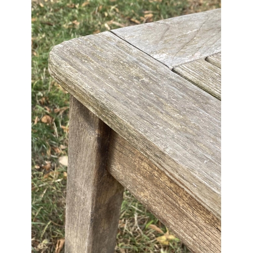 147 - GARDEN TABLE, 120cm x 70cm x 70cm H, weathered teak and slatted.