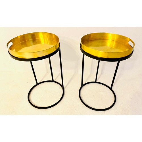 332 - SIDE TABLES, a pair, 50cm H x 42cm diam., gilt metal tray tops, on black metal supports. (2)