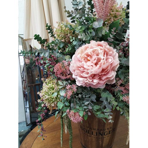 313 - FAUX FLORAL DISPLAY, 100cm H, in a vessel stamped Bollinger Champagne.