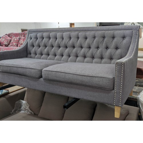 418 - SOFA, 194cm L x 90cm H with a buttoned back, studded decoration and grey upholstery.