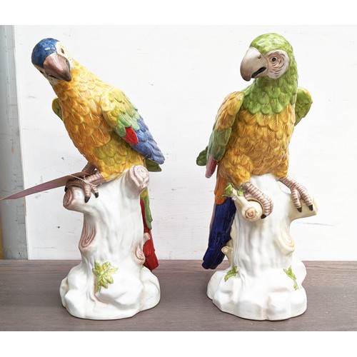 593 - SCUPTURAL PARROTS, a pair, 42cm H, glazed ceramic. (2)