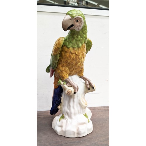 593 - SCUPTURAL PARROTS, a pair, 42cm H, glazed ceramic. (2)