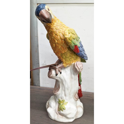 593 - SCUPTURAL PARROTS, a pair, 42cm H, glazed ceramic. (2)