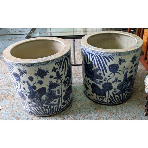 599 - PLANTERS, a pair, 50cm high, 48cm diameter, Chinese export style blue and white ceramic. (2)