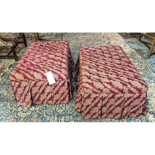 590 - GEORGE SMITH FOOTSTOOLS, a pair, 95cm W x 60cm x 45cm H, with buttoned tops and pleated skirt to bas... 