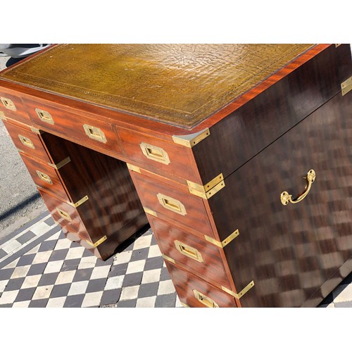 379 - CAMPAIGN STYLE PEDESTAL DESK, 78cm H x 122cm W x 60cm D, mahogany and brass bound, with green leathe... 