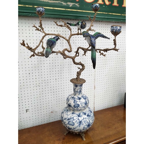 595 - CANDELABRA, 72cm H, glazed ceramic with gilt mounts, three branch.