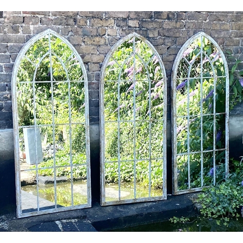 544 - ARCHITECTURAL WALL MIRRORS, 160cm high, 67cm wide, set of three, Gothic style, arched design aged pa... 