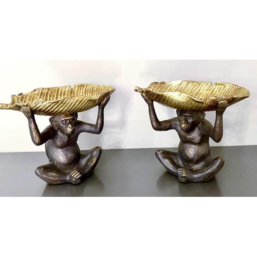 527 - TRINKET DISHES, pair, in the form of Monkeys holding gilt Banana leaves aloft, 33cm x 40cm x 18cm (2... 