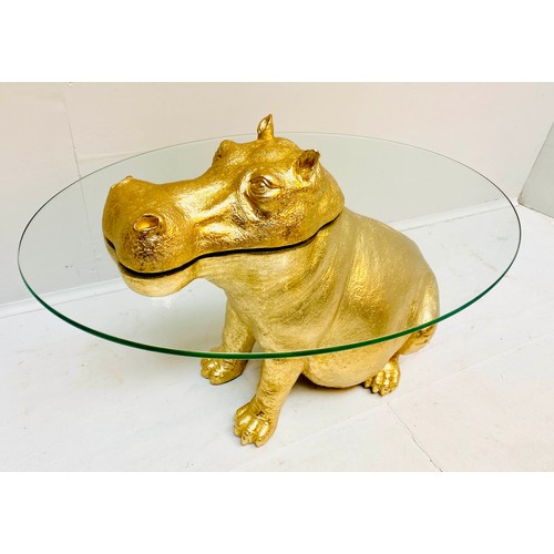 609 - HIPPOPTAMUS LOW TABLE, 65cm x 50cm x 45cm, gilt resin and glass.