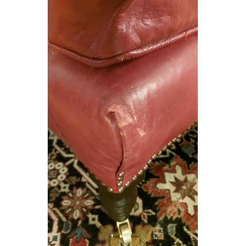 125 - ARMCHAIR, 90cm H x 82cm W, Victorian Howard style, with studded red leather upholstery.