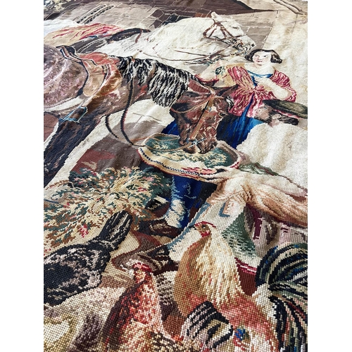 19 - WOOLWORK TAPESTRY, depicting a stable scene, 243cm x 210cm.