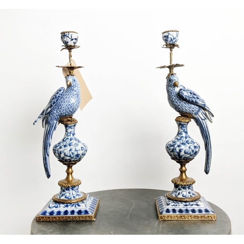 CANDELABRA, a pair, 48cm H, in the form of birds, blue and white ceramic, gilt metal mounts. (2)