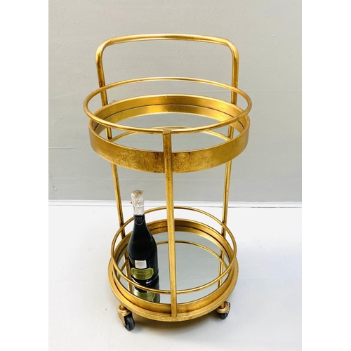 507 - COCKTAIL TROLLEY, 77cm high, 42cm diameter, 1960s French style, mirrored glass tiers, gilt metal fra... 