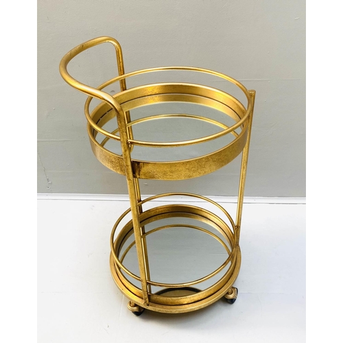 507 - COCKTAIL TROLLEY, 77cm high, 42cm diameter, 1960s French style, mirrored glass tiers, gilt metal fra... 