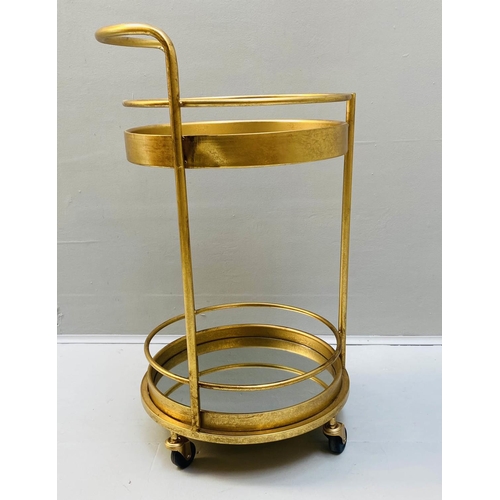 507 - COCKTAIL TROLLEY, 77cm high, 42cm diameter, 1960s French style, mirrored glass tiers, gilt metal fra... 