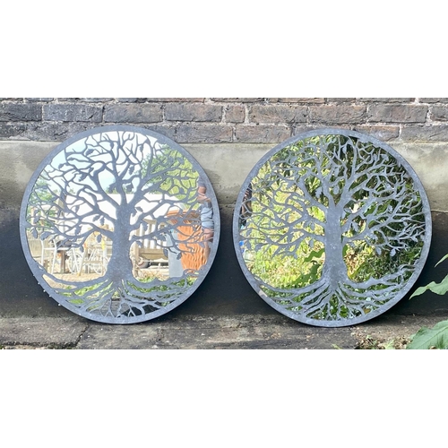 516 - GARDEN WALL MIRRORS, a pair, 80cm diameter, overlaid decoration with tree design. (2)