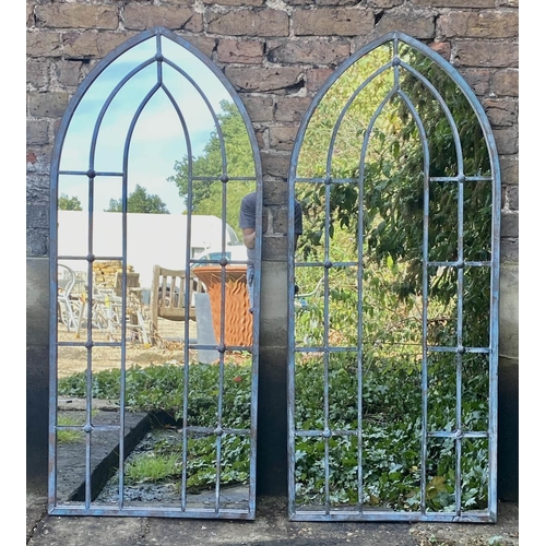 517 - ARCHITECTURAL GARDEN MIRRORS, 140cm high, 60cm wide, a pair, arched frames. (2)