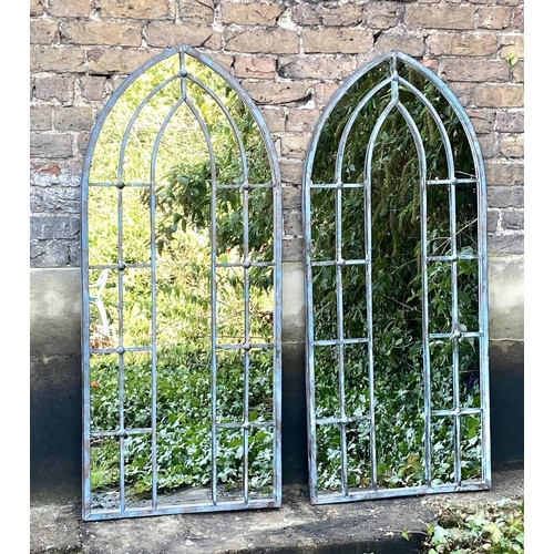 517 - ARCHITECTURAL GARDEN MIRRORS, 140cm high, 60cm wide, a pair, arched frames. (2)