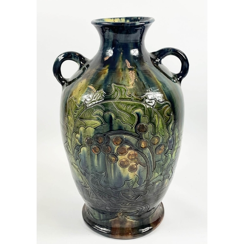 6 - C.H. BRANNAM BURUMWARE POTTERY VASE, incised decoration of leaves and berries in blue, green, ochre ... 