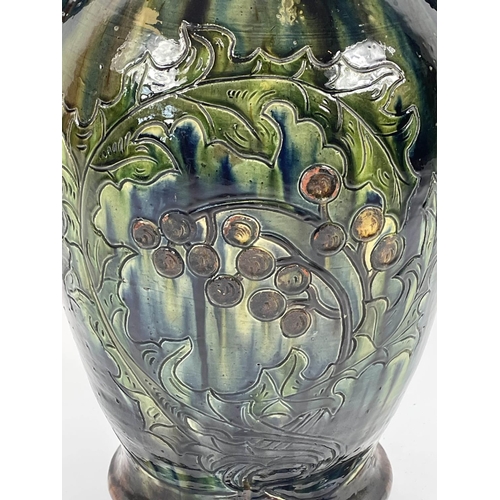 6 - C.H. BRANNAM BURUMWARE POTTERY VASE, incised decoration of leaves and berries in blue, green, ochre ... 