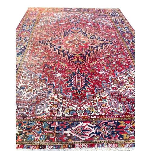 69 - ANTIQUE PERSIAN HERIZ CARPET, 330cm x 240cm.