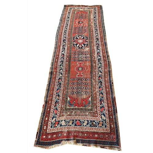 80 - ANTIQUE RUGS, a collection of three, largest 330cm x 97cm. (3)