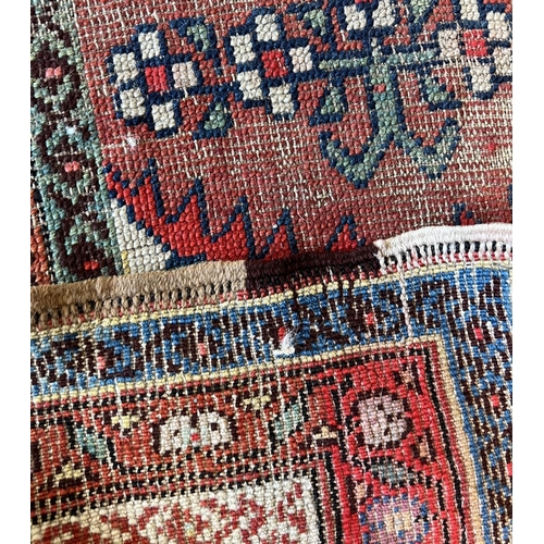 80 - ANTIQUE RUGS, a collection of three, largest 330cm x 97cm. (3)