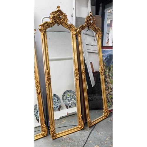 435 - PIER MIRRORS, a pair, Continental style, gilt frames, bevelled plate, 178cm x 53cm each. (2)